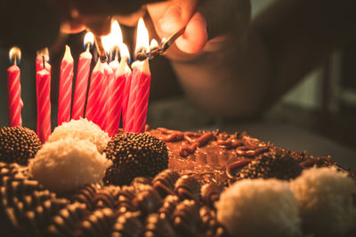 Close-up of hand holding cake