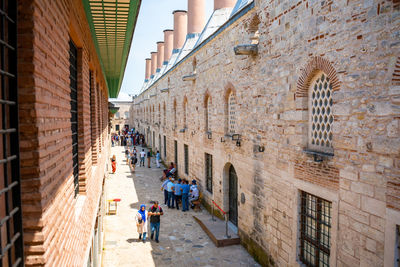 People walking on street in city