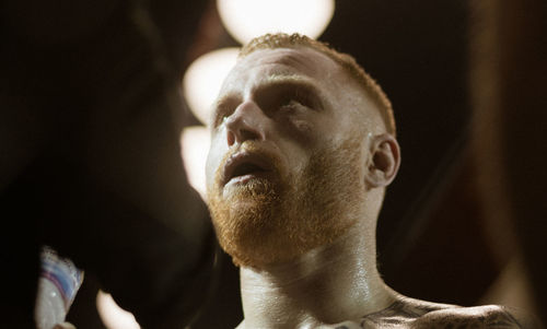 Participant taking a breather in between an mma fight