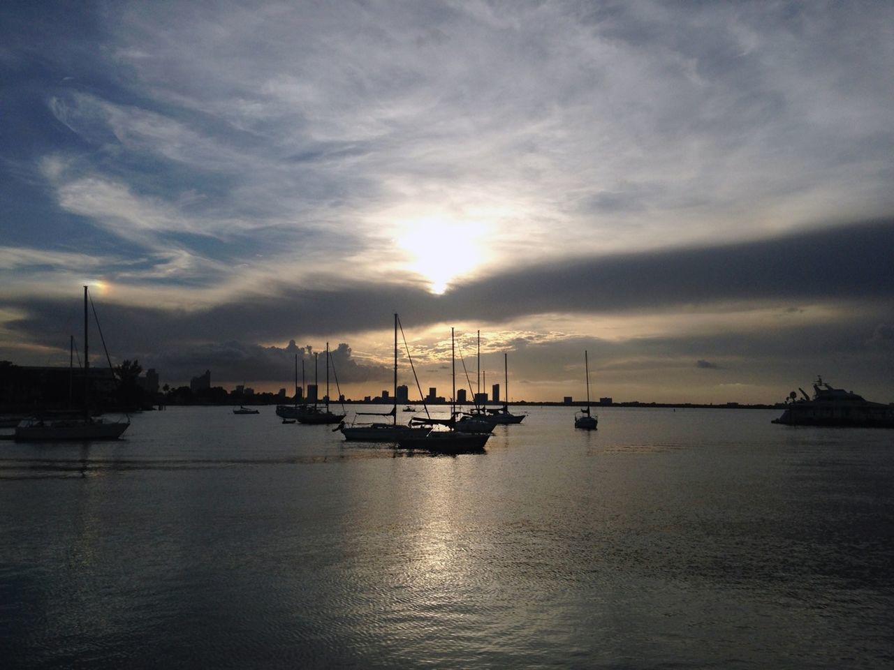 nautical vessel, transportation, mode of transport, boat, water, sunset, sea, sky, waterfront, cloud - sky, moored, scenics, tranquility, tranquil scene, silhouette, mast, beauty in nature, cloudy, nature, cloud