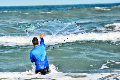 Rear view of man on beach