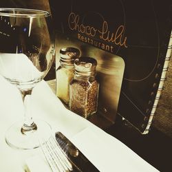 Close-up of wine glasses on table in restaurant