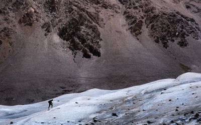 High angle view of person on snowcapped mountain