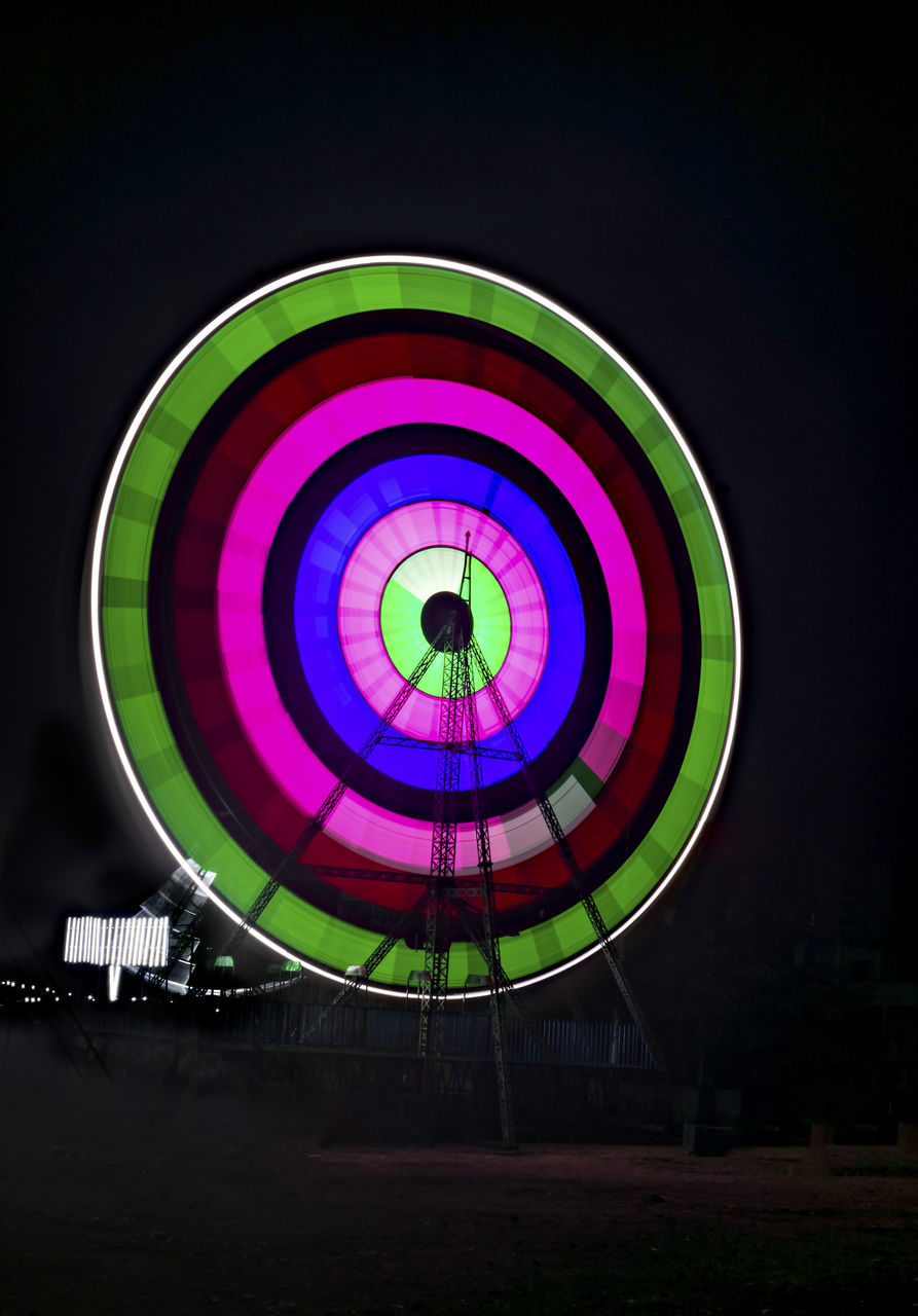 multi colored, circle, geometric shape, night, shape, illuminated, light, amusement park ride, amusement park, no people, arts culture and entertainment, ferris wheel, sky, spinning, long exposure, motion, sports, nature