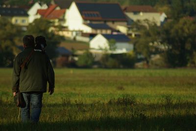 Man standing on grassy field