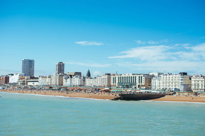 Sea with city in background