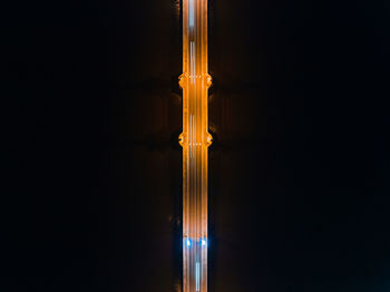 Aerial view of light trails on bridge at night