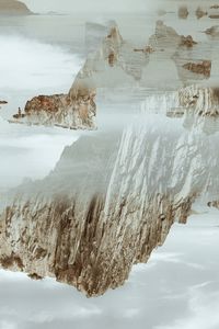 Multiple exposure collage with rocks and sea