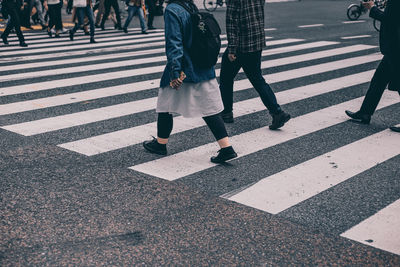 Woman walking on road