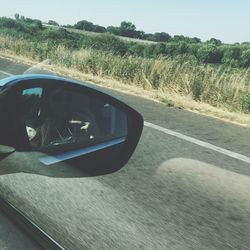 Cropped image of car on road