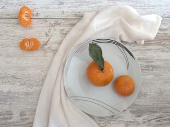 High angle view of orange fruit on table