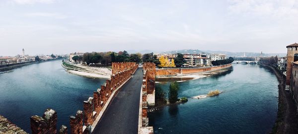 Panoramic view of bridge over river against sky