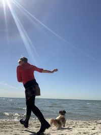 Man with dog on beach