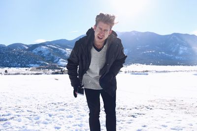 Portrait of a smiling man in snow