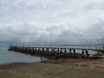 Pier over sea against sky