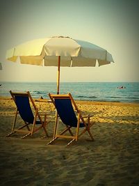 Empty beach against clear sky