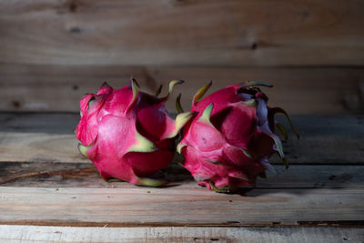 Close-up of pink roses on table