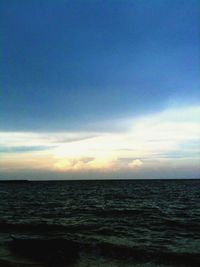 Scenic view of sea against sky at sunset