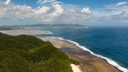Top view of tropical island coastline and blue ocean. luzon, santa ana, cagayan. philippines.