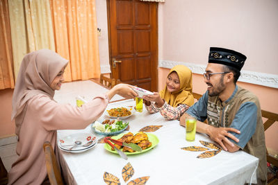 Happy family celebrating eid at home