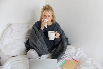 Young woman using phone