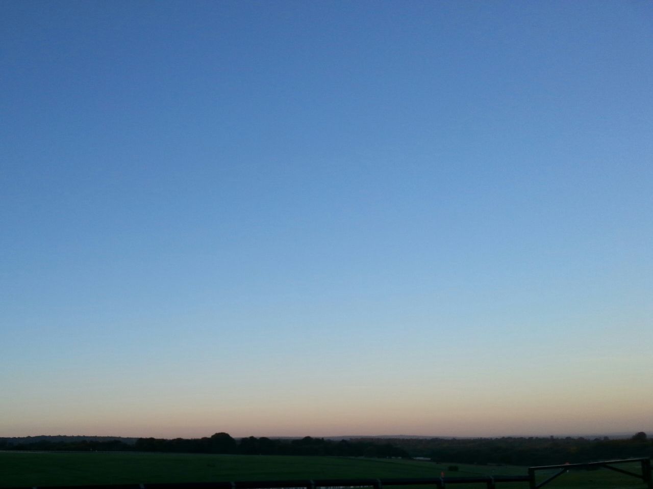 copy space, clear sky, landscape, tranquil scene, tranquility, field, scenics, beauty in nature, blue, nature, horizon over land, sunset, silhouette, idyllic, rural scene, dusk, outdoors, no people, grass, remote