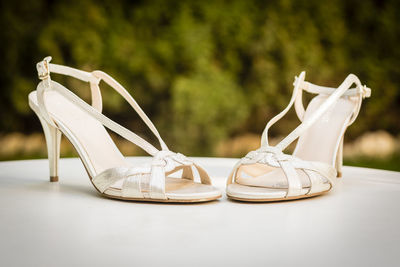 Close-up of shoes on table