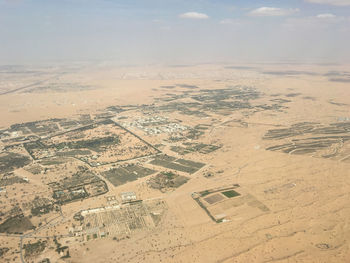 Aerial view of agricultural landscape against sky