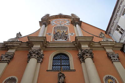 Low angle view of ornate building against sky