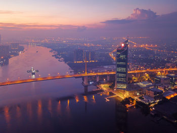 High angle view of illuminated buildings in city at night