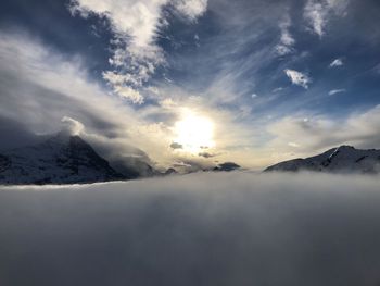 Scenic view of snowcapped mountains against sky during winter