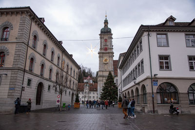 People walking on street in city