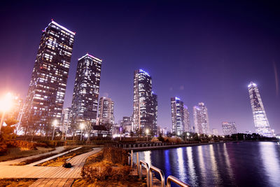 Illuminated buildings in city at night