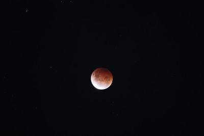 Low angle view of moon against sky at night