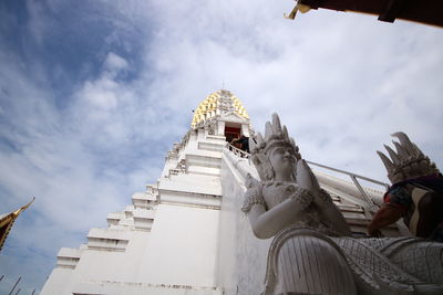 Low angle view of statue against building