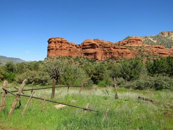 Scenic view of red rock mountains against clear blue sky