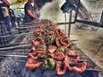 Close-up of meat on barbecue grill