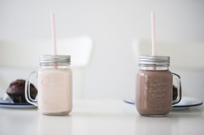 Close-up of drinks in jar on table