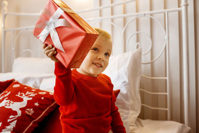 Portrait of cute girl holding gift