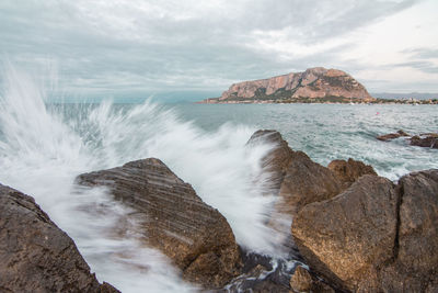 Scenic view of sea against cloudy sky