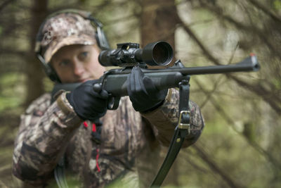 Woman hunting in forest