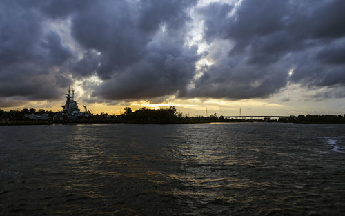 Scenic view of sea against storm clouds