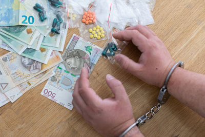 Dealer in handcuffs for possession of a substantial amount of drugs.