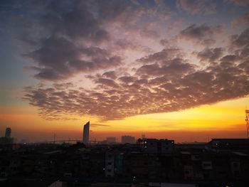 High angle view of buildings against sky during sunset