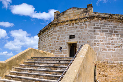 Low angle view of steps against sky