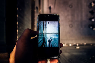 Close-up of hand using mobile phone