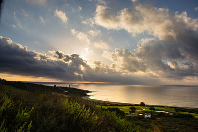 Scenic view of sea against sky during sunset