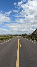 Empty road against sky