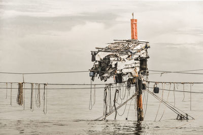 Low angle view of electricity pylon against sky