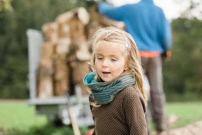 Close-up of cute girl looking away